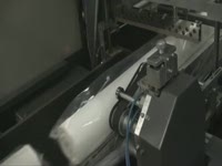 Упаковка обоев в плёнку на автоматической линие