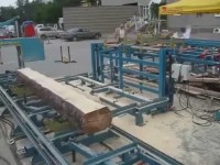 Линия распиловки тонкомерной древесины из брусующего, лафетного многопильных станков и ленточной пилорамы