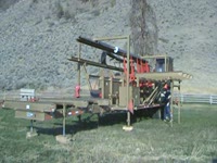 Twin-Cut portable sawmill log deck transport ready
