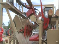 Twin-Cut Sawmill saws a bowed log