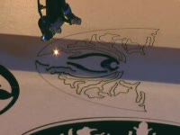 Лазерный станок для раскроя материалов и гравирования. Выставка WMF 2010 в Пекине