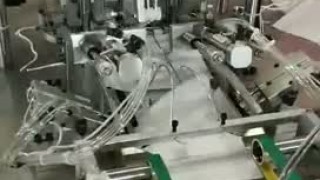 Автоматический припаиватель  ушных резинок к маскам