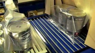 Термоупаковочная машина Альфапак-550РТ  упаковка банок с краской